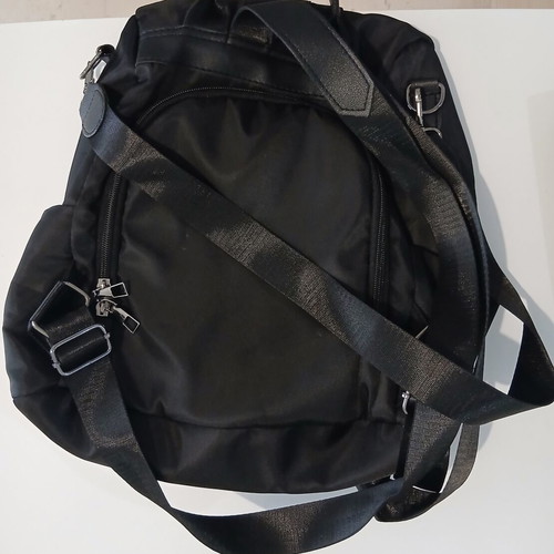 Black backpack with rear compartment opening