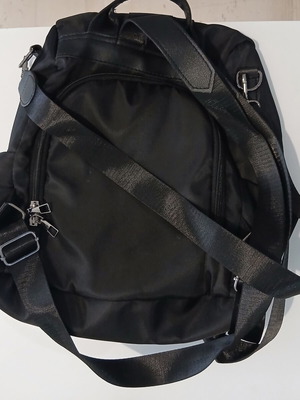 Black backpack with rear compartment opening