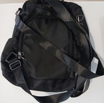 Black backpack with rear compartment opening