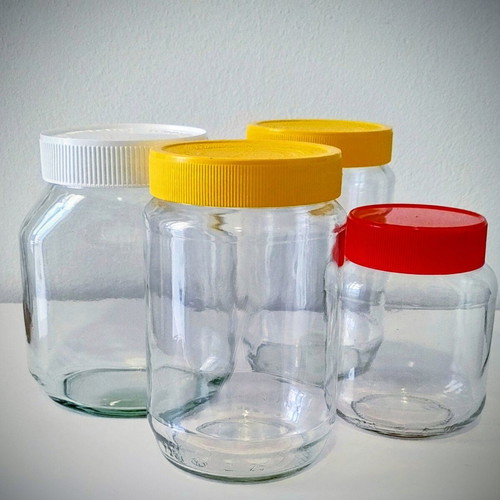 Set of 4 Glass Storage Jars with Plastic Lids like new