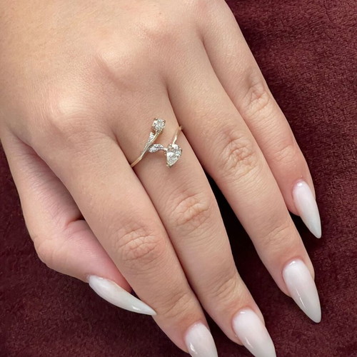 Women's 14K gold ring like new with round cut and pear-shape stones
