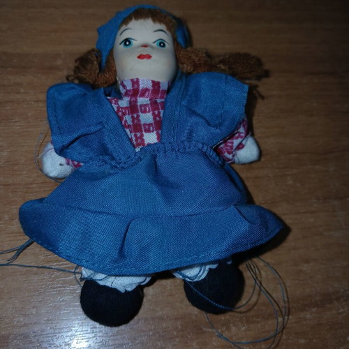 Porcelain doll small, used