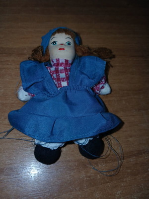 Porcelain doll small, used