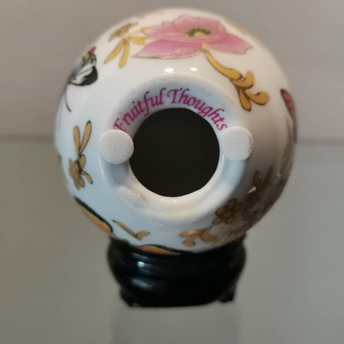 Porcelain egg used with butterflies and wooden base