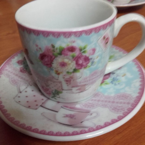 Coffee set with flowers used, three cups with saucers