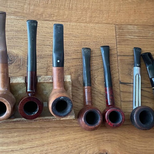 Smoking accessories like new, pipes, stands, pouches and cleaning tools