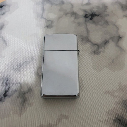 Zippo lighter used small size with engraved design