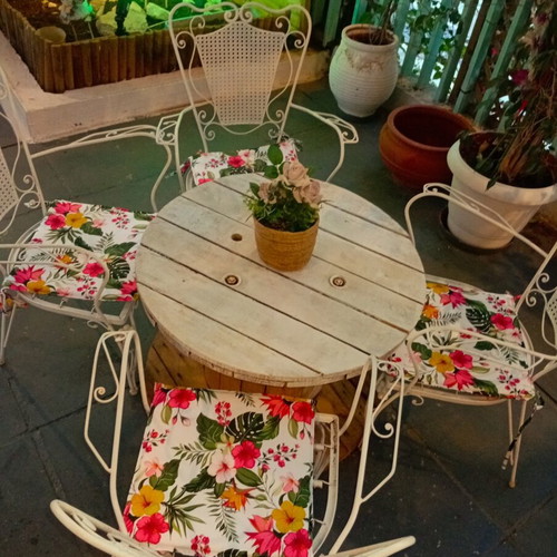 Wrought iron chairs set with round wooden table, vintage