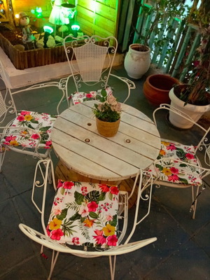 Wrought iron chairs set with round wooden table, vintage