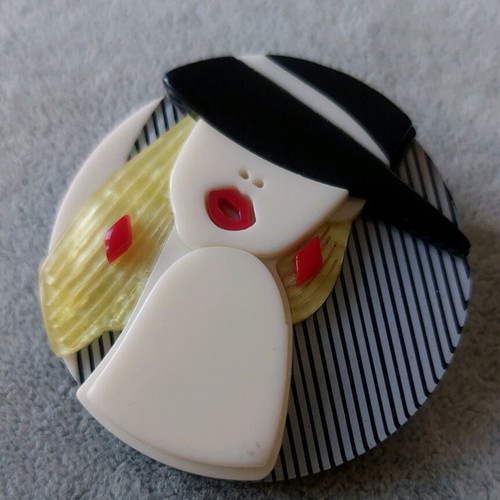 Large Plexiglass pin like new, multicolored with female face design