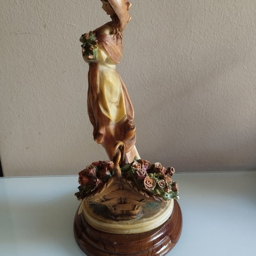 Vintage Italian decorative statue of a girl with roses, used