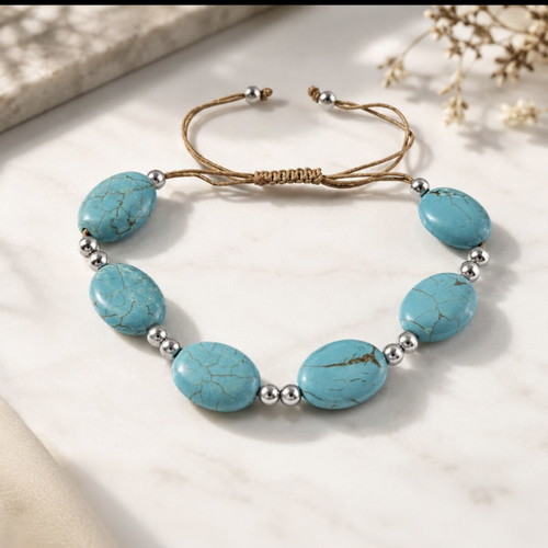 Handmade turquoise bracelet with silver details, adjustable cord