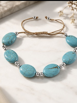 Handmade turquoise bracelet with silver details, adjustable cord