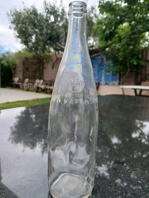 Glass bottle used with embossed HBH Karantani logo