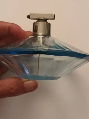 Vintage cobalt blue perfume bottle used, multifaceted diamond shape