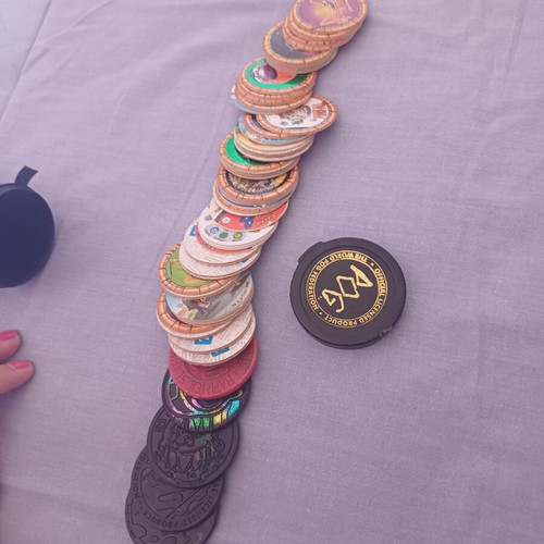 Vintage Pogs collection with Pokemon and Looney Tunes
