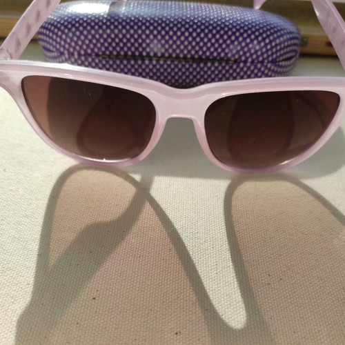 Purple sunglasses used with case