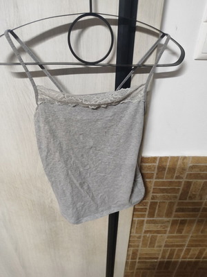 Women's grey top with thin straps and lace neckline