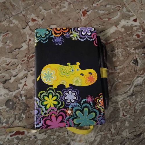 Notebook with hard cover and colorful floral design, like new