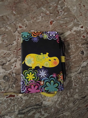 Notebook with hard cover and colorful floral design, like new