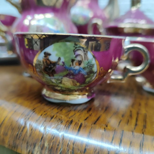 Porcelain coffee set used, 15 pieces, burgundy-fuchsia with gold details