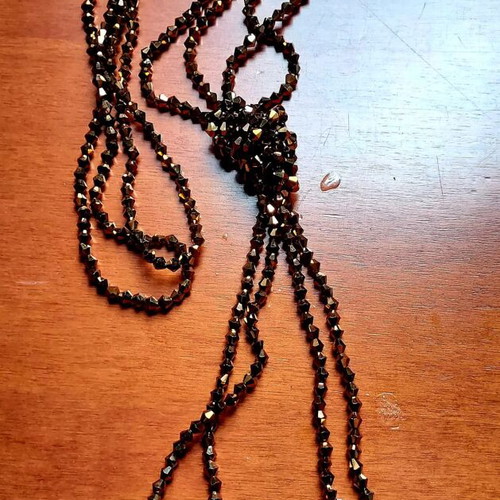 Lariat Necklace like new with brown crystal beads