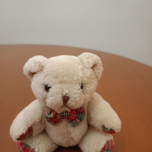 Plush teddy bear with plaid bow tie like new