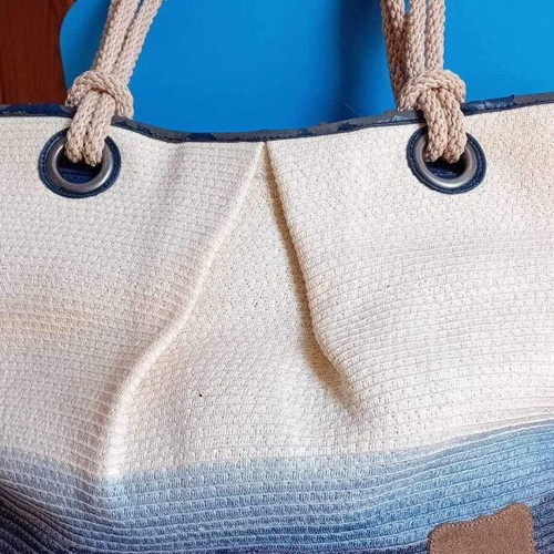 Beach bag used with worn leather