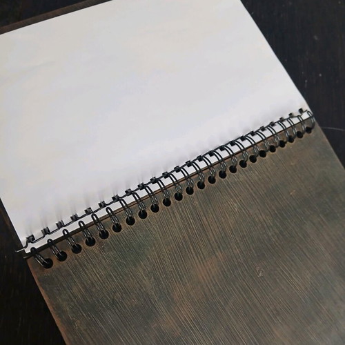 Iron notebook like new with embossed designs and magnet