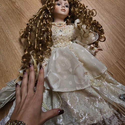 Glass Bride Doll like new with lace dress and hat