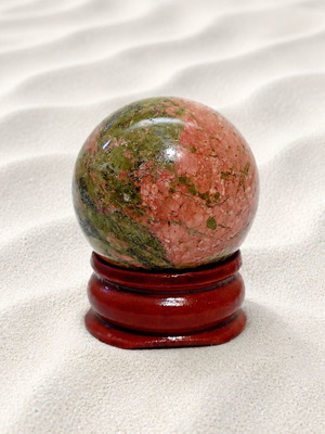 Decorative desk sphere with rosewood base and unakite stone
