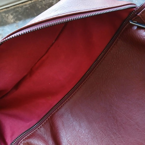 Women's burgundy backpack bag used