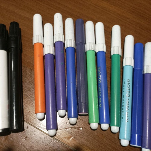 Various school supplies used with Giotto markers and pencil cases