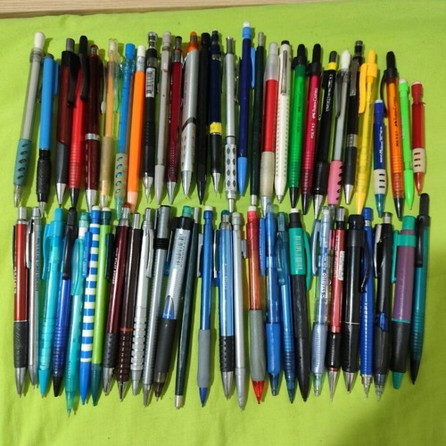 Pens and mechanical pencils used, with cases, erasers, sharpeners