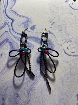 Black earrings with multicolored beads used