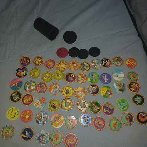 Vintage Pogs collection with Pokemon and Looney Tunes