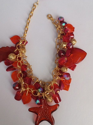 Summer bracelet with red charms, gold, handmade