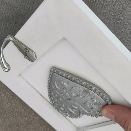 Picture frame hanger used with corner wear