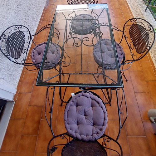 Black wrought iron garden set used with table and 4 chairs