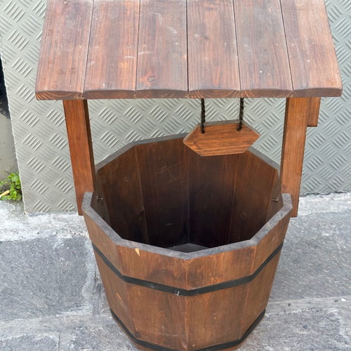 Decorative wooden wishing well for planter used