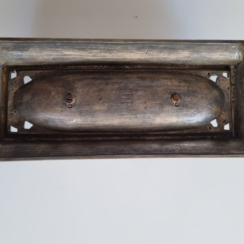 Vintage metal pen tray used with embossed floral motifs and dolphin supports