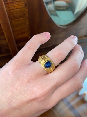 Old ring like new, gold-colored with blue stone