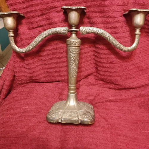 Metal triple candlestick used, ornate and heavy