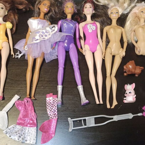 Barbie and other toys used, in moderate condition