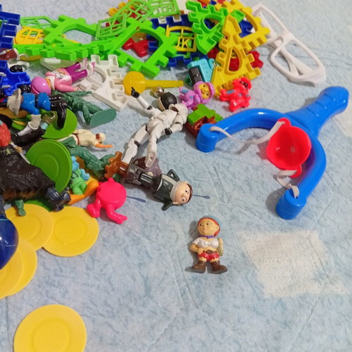 Toy pack with action figures, army men, and construction blocks like new