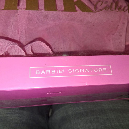 Barbie doll collectible like new with stand