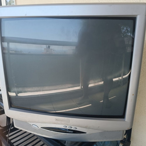 Schaub Lorenz 21-inch TV like new, silver color with remote
