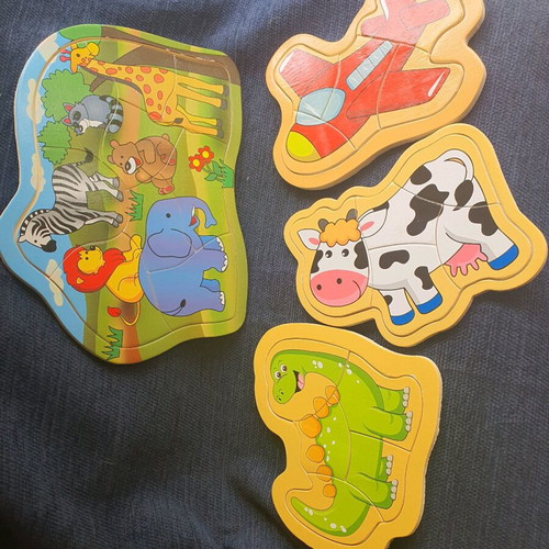 Puzzle like new, set of 4 with animals, dinosaur, cow and airplane