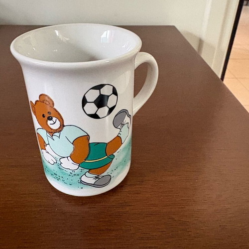 Late 80s children's cup with teddy bear playing football like new