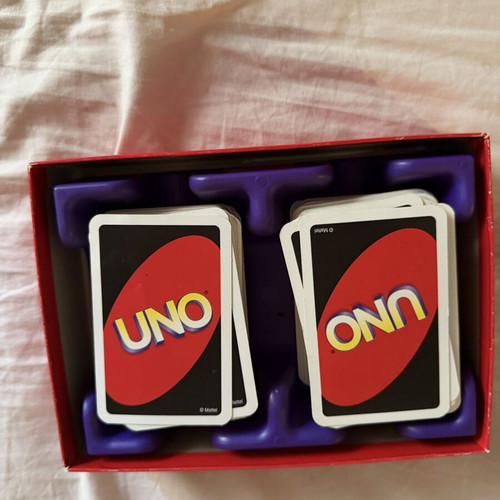 Uno Deluxe card game used with base and score notebook